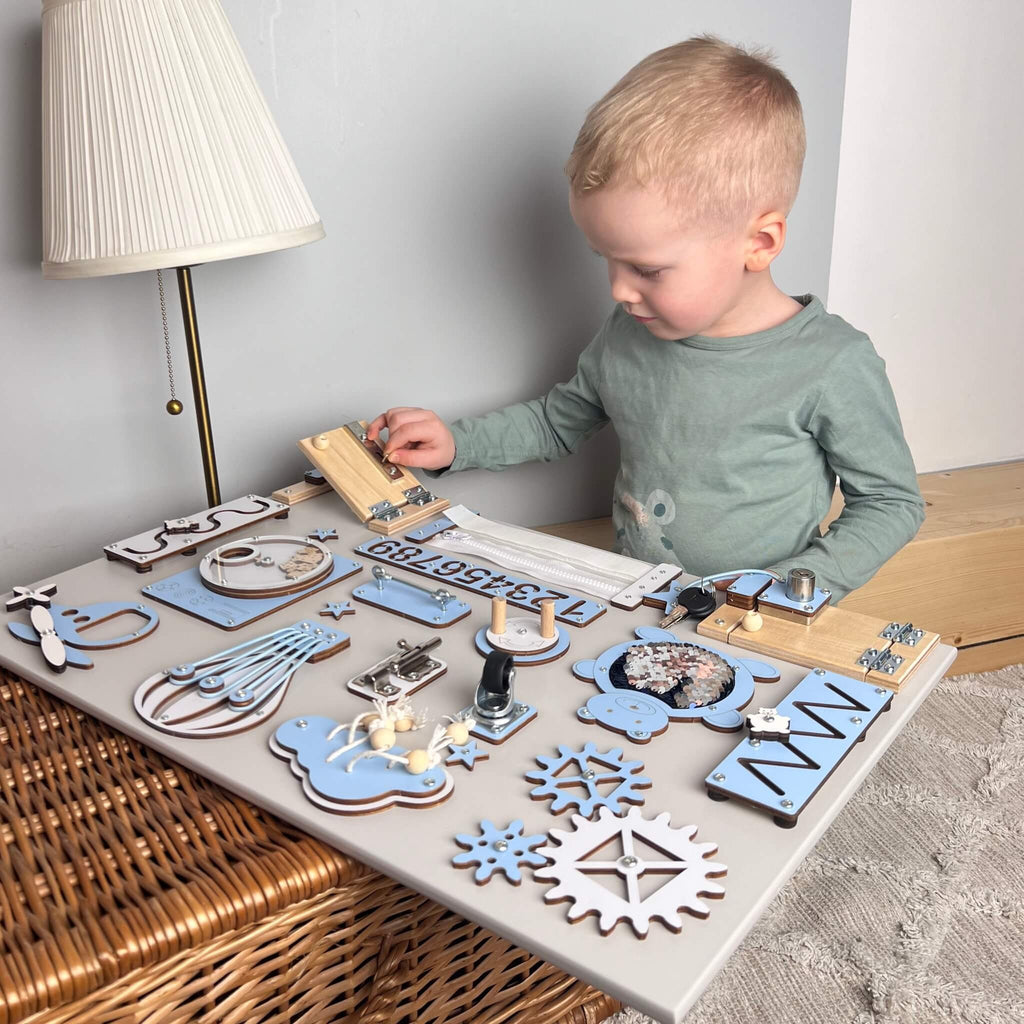 Montessori busy board with doors and locks (40×60 cm)